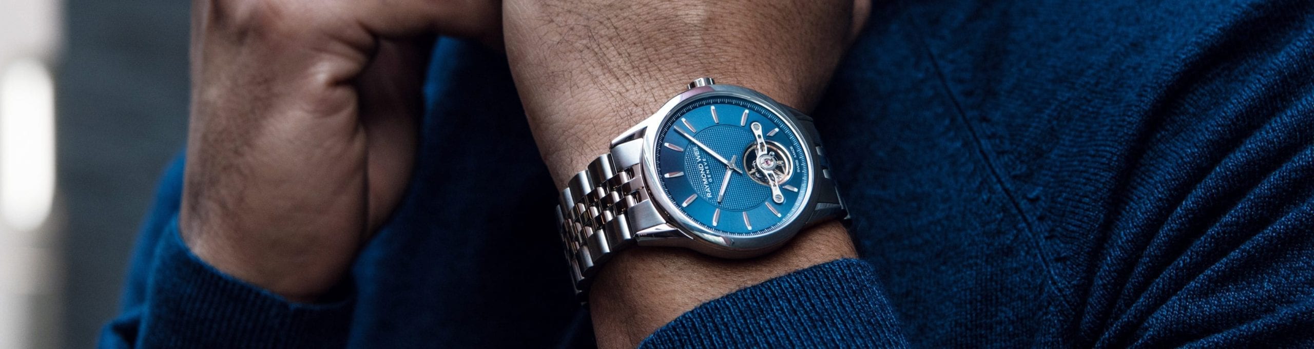RAYMOND WEIL Blue Men's Freelancer Automatic Watch with a Visible Balance Wheel.